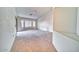 Living room featuring carpet, large windows, and a cozy atmosphere at 1612 E South Mountain Ave, Phoenix, AZ 85042