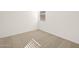 Bedroom with neutral carpet and a window bringing in natural light at 17449 W Eva St, Waddell, AZ 85355