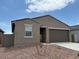 Inviting single-story home with a two-car garage and drought-tolerant landscaping at 17449 W Eva St, Waddell, AZ 85355