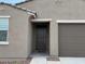Close up view of the front entrance featuring a dark door and matching hardware at 17449 W Eva St, Waddell, AZ 85355