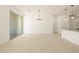 Bright living room featuring tile flooring and a sliding glass door leading to the backyard at 17449 W Eva St, Waddell, AZ 85355