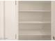 Interior view of an empty, spacious white walk-in pantry with adjustable shelving at 17449 W Eva St, Waddell, AZ 85355