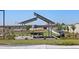 A lush community park boasts picnic tables, benches, and green spaces at 17449 W Eva St, Waddell, AZ 85355
