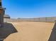 This is a backyard view with a concrete block wall and a blank canvas for landscaping at 17624 W Pierson St, Goodyear, AZ 85395