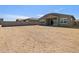This is a view of the backyard. The home has a covered patio at 17624 W Pierson St, Goodyear, AZ 85395