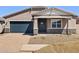 Inviting single-Gathering home boasts a stylish facade and a two-car garage in a well-maintained neighborhood at 17624 W Pierson St, Goodyear, AZ 85395