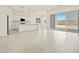 Open-concept living area combines a modern kitchen with stainless steel appliances and a spacious living room at 17624 W Pierson St, Goodyear, AZ 85395