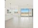 Modern living area seamlessly connects the kitchen, dining space, and outdoor patio via large sliding glass doors at 17624 W Pierson St, Goodyear, AZ 85395