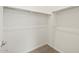 Here is a walk-in closet featuring white shelving at 17624 W Pierson St, Goodyear, AZ 85395