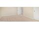 Bedroom showcases neutral walls and carpet, with ample natural light from the doorway at 1870 E Indigo Dr, Chandler, AZ 85286