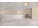 Spacious bonus room with neutral carpet, ceiling fan, and built-in desk area at 1870 E Indigo Dr, Chandler, AZ 85286