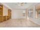 Versatile bonus room with built-in shelving and large windows offering natural light at 1870 E Indigo Dr, Chandler, AZ 85286