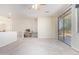 Bonus room features carpet, ceiling fan, balcony, and dedicated desk space at 1870 E Indigo Dr, Chandler, AZ 85286
