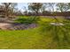 Lush community green space showcasing manicured lawn and decorative rocks, enhancing the neighborhood's appeal at 1870 E Indigo Dr, Chandler, AZ 85286