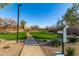 Convenient community dog waste station along a paved pathway, promoting cleanliness and responsible pet ownership at 1870 E Indigo Dr, Chandler, AZ 85286