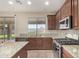 Well-equipped kitchen featuring stainless steel appliances and granite countertops at 1870 E Indigo Dr, Chandler, AZ 85286