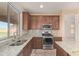 Kitchen featuring stainless steel appliances, granite counters, and ample natural light at 1870 E Indigo Dr, Chandler, AZ 85286