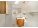 A laundry room with wood cabinets, tile flooring, and window at 1870 E Indigo Dr, Chandler, AZ 85286