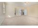 Large main bedroom features neutral carpet, natural light, and ensuite bathroom access at 1870 E Indigo Dr, Chandler, AZ 85286