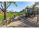 Vibrant playground with slide and climbing features, surrounded by lush greenery, creating a fun recreational area at 1870 E Indigo Dr, Chandler, AZ 85286