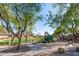 Well-equipped playground with play structure, benches and mature landscaping, providing a safe and inviting space for  at 1870 E Indigo Dr, Chandler, AZ 85286