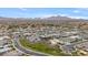 Panoramic aerial view of the neighborhood showing homes in a desert landscape against a backdrop of mountains at 19726 E Vallejo St, Queen Creek, AZ 85142