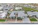 A high-angle view showcases the home's architectural design, desert landscape, and multi-car driveway, nestled in a Primary-planned community at 19726 E Vallejo St, Queen Creek, AZ 85142