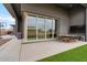Spacious backyard featuring a dining area, built in TV, and sliding glass doors at 19726 E Vallejo St, Queen Creek, AZ 85142