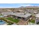 Features a modern backyard with pool and landscaping, designed for outdoor living and entertaining in a desert environment at 19726 E Vallejo St, Queen Creek, AZ 85142