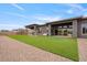 Large backyard with artificial turf, sport nets, and outdoor seating at 19726 E Vallejo St, Queen Creek, AZ 85142