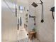 Modern bathroom featuring a glass-enclosed shower with a rainfall showerhead and a wooden stool at 19726 E Vallejo St, Queen Creek, AZ 85142