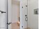 Modern bathroom features a frameless glass shower with white textured tile and a niche for toiletries at 19726 E Vallejo St, Queen Creek, AZ 85142