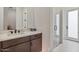 Modern bathroom features a sleek vanity, a glass-enclosed shower, and a clean design at 19726 E Vallejo St, Queen Creek, AZ 85142