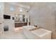 Stylish bathroom featuring a freestanding tub, modern fixtures, and lots of natural light at 19726 E Vallejo St, Queen Creek, AZ 85142
