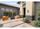 Cozy courtyard with modern seating around a fire pit and lush landscaping at 19726 E Vallejo St, Queen Creek, AZ 85142