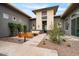 Picturesque courtyard featuring a seating area, pavers, and desert landscaping at 19726 E Vallejo St, Queen Creek, AZ 85142