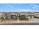 Beautiful single-story home showcasing modern design, desert landscaping, and a three car garage at 19726 E Vallejo St, Queen Creek, AZ 85142