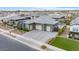 Charming exterior features a desert landscape, well-manicured lawn, and spacious garage, perfect for suburban living at 19726 E Vallejo St, Queen Creek, AZ 85142