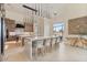 Modern kitchen with large island, chairs, and stylish hanging lights at 19726 E Vallejo St, Queen Creek, AZ 85142