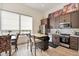 Stylish kitchen featuring modern appliances, ample counter space, and a cozy dining area at 19726 E Vallejo St, Queen Creek, AZ 85142