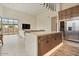 Contemporary kitchen with oversized island, stainless steel appliances, and open-concept design at 19726 E Vallejo St, Queen Creek, AZ 85142