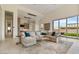 Spacious living area boasts modern design, comfortable seating, and a seamless flow to the outdoors at 19726 E Vallejo St, Queen Creek, AZ 85142