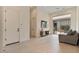 Inviting living room with a sliding glass door to the patio and a modern entertainment center at 19726 E Vallejo St, Queen Creek, AZ 85142