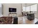 Bright living room featuring modern decor, a large TV, and comfortable seating at 19726 E Vallejo St, Queen Creek, AZ 85142