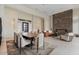 Elegant open-concept living room with fireplace feature and dining area at 19726 E Vallejo St, Queen Creek, AZ 85142