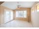 Bright living room features tile floors, double doors, and plantation shutters at 20027 N 110Th Ln, Peoria, AZ 85373