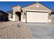 Charming single-story home with a two-car garage and low maintenance front yard at 23248 W Miami St, Buckeye, AZ 85326