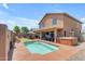 A perfect backyard with a pool, jacuzzi, outdoor kitchen, and turf at 2635 W Angel Way, San Tan Valley, AZ 85144