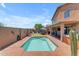 Relaxing backyard featuring a pool, patio, turf, and a desert landscape at 2635 W Angel Way, San Tan Valley, AZ 85144