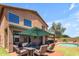 Entertainer's backyard with pool, large patio, outdoor kitchen, and lush turf at 2635 W Angel Way, San Tan Valley, AZ 85144